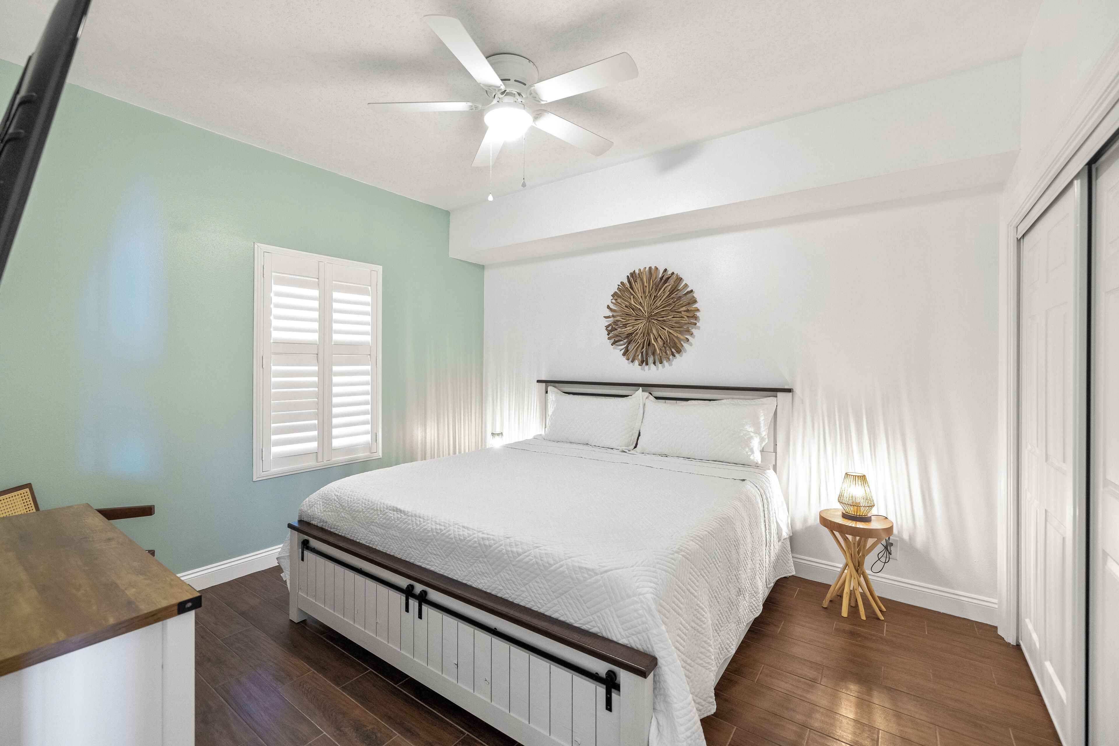 Bedroom 2 with King bed, TV, dresser, and closet.  Upgraded mattress and linens.